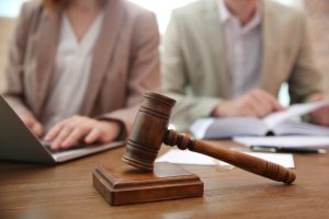 Two lawyers working on a public liability compensation claim.