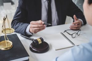 A solicitor helping a client make an office accident claim.