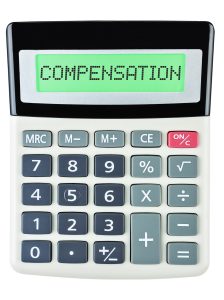 A calculator with the word 'compensation' written across the screen.